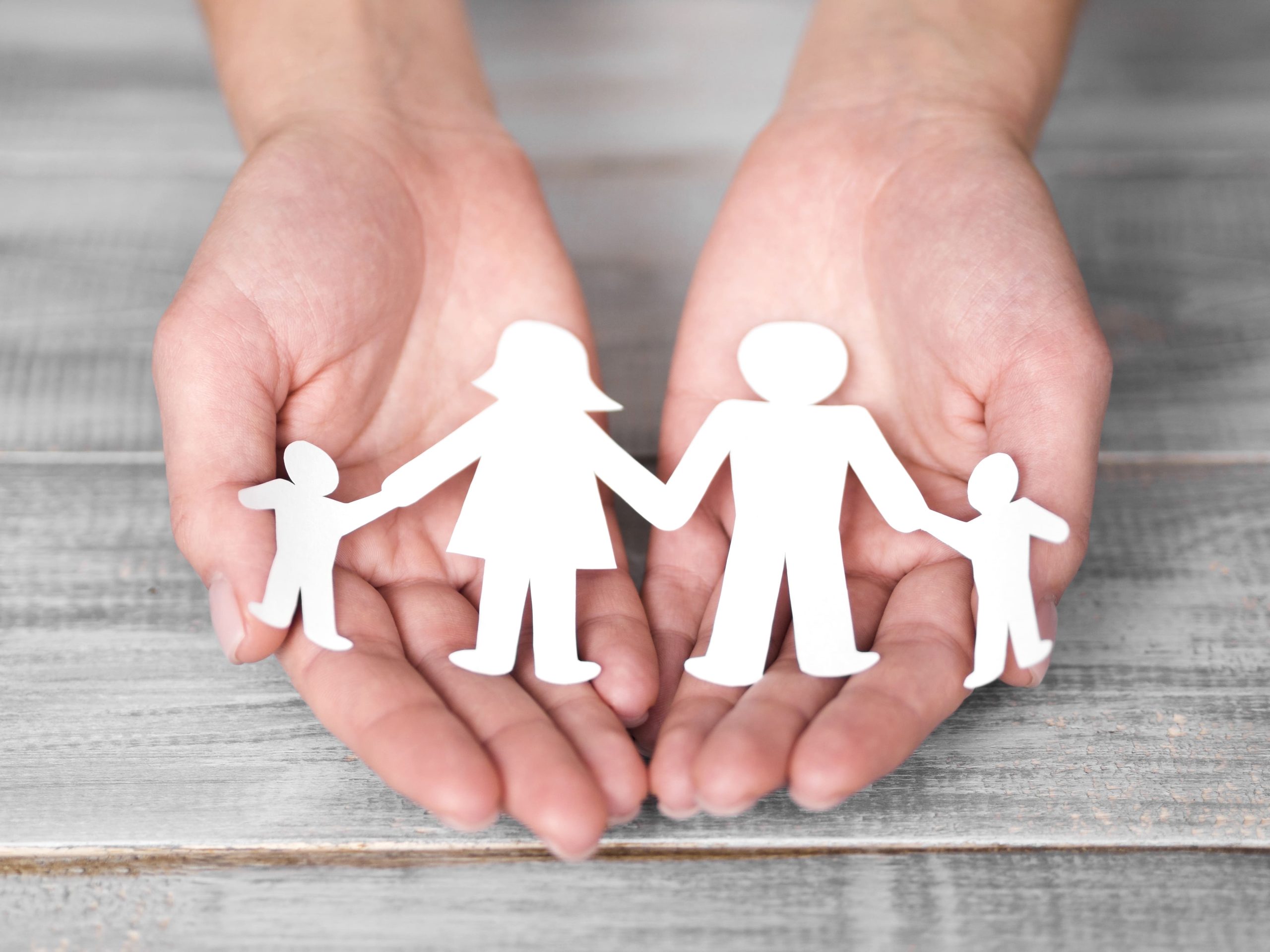 high-angle-cute-family-concept-composition-wooden-background